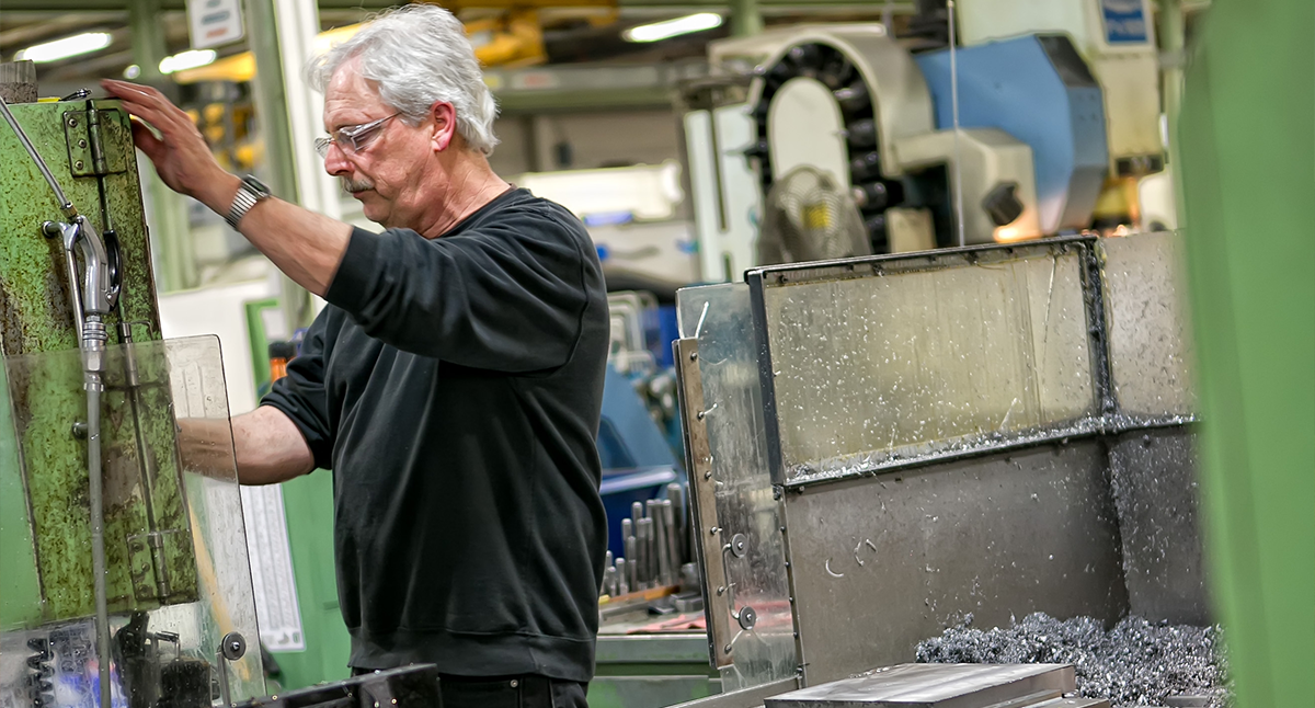Bartell employee working with machine